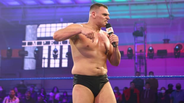 WWE's Walter in the ring with a microphone on NXT